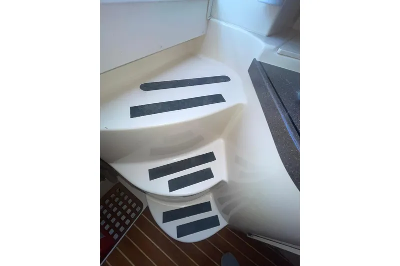  Yacht Photos Pics Staircase with non-slip strips on a 2003 Grady-White Express 330 boat.
