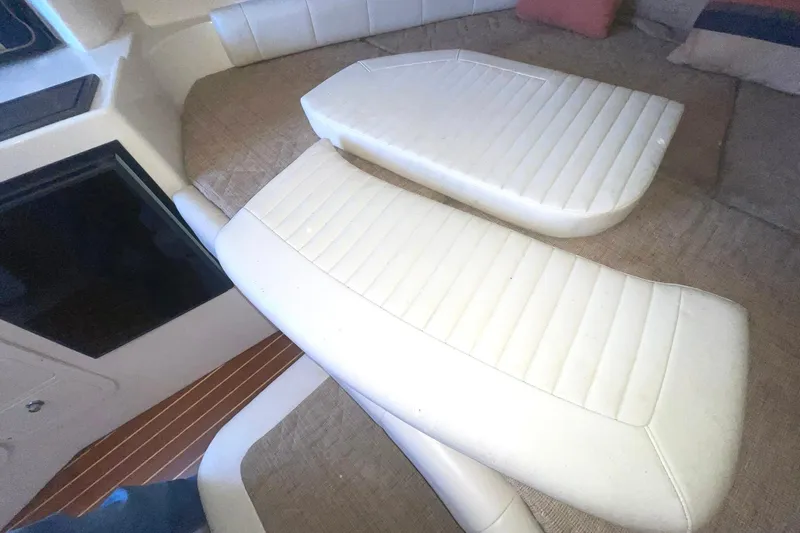  Yacht Photos Pics Interior seating of 2003 Grady-White Express 330 boat, featuring white cushioned seats.