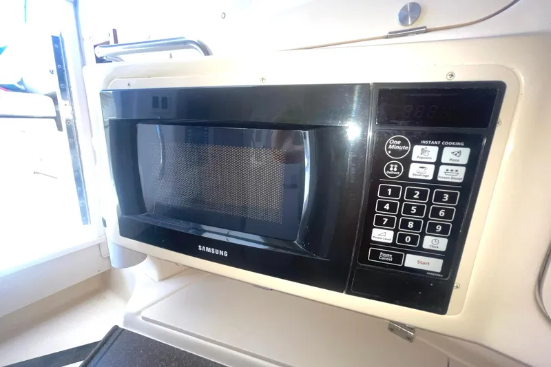  Yacht Photos Pics Samsung microwave inside a 2003 Grady-White Express 330 boat kitchen area.