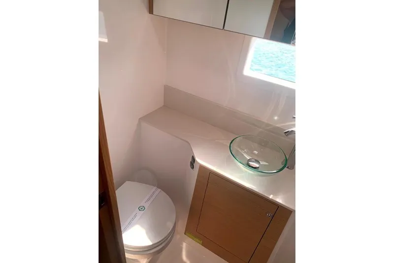  Yacht Photos Pics Modern bathroom in 2020 Dufour Catamarans 48 with glass sink and compact design.
