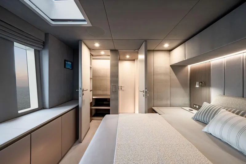  Yacht Photos Pics Luxurious interior of 2025 Sunreef 80 yacht, featuring modern bedroom design and ambient lighting.