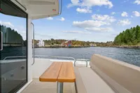 Nimbus C11 boat deck with scenic waterfront view, 2021 model.