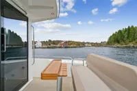 Nimbus C11 boat interior with scenic waterfront view, 2021 model.