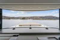 2021 Nimbus C11 boat interior with scenic water and mountain view through the window.