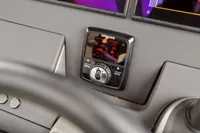 Control panel of a 2021 Nimbus C11 boat with digital display and controls.