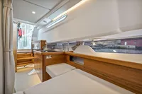 2021 Nimbus C11 boat interior with modern wood finish and seating area.