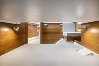 Luxurious interior of 2021 Nimbus C11 boat with modern wood finish and ambient lighting.