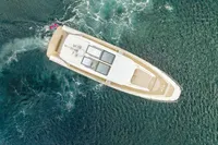 Aerial view of 2021 Nimbus C11 yacht cruising in clear blue waters.