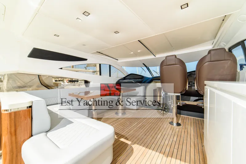  Yacht Photos Pics Luxurious interior of 2004 Sunseeker Predator 68 yacht with modern seating and wooden flooring.