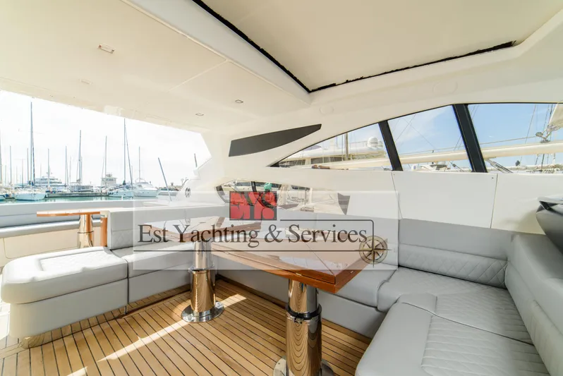 Yacht Photos Pics Luxurious interior of 2004 Sunseeker Predator 68 yacht with elegant seating and wooden table.
