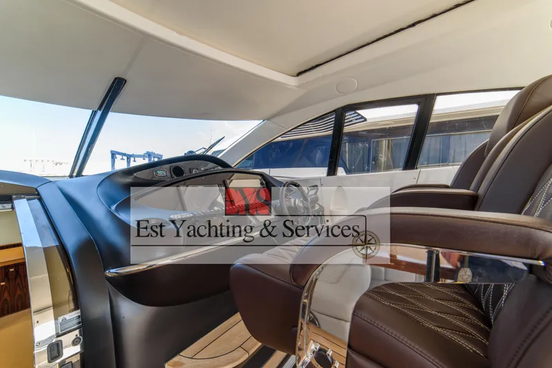  Yacht Photos Pics Luxurious interior of 2004 Sunseeker Predator 68 yacht with modern steering console.
