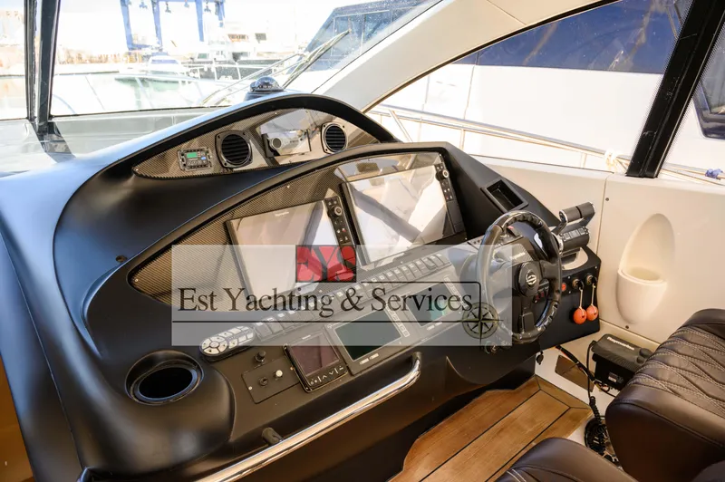  Yacht Photos Pics Helm of 2004 Sunseeker Predator 68 yacht with modern navigation equipment.