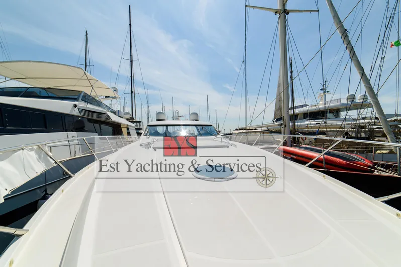  Yacht Photos Pics 2004 Sunseeker Predator 68 yacht docked at marina, showcasing sleek design and luxury features.