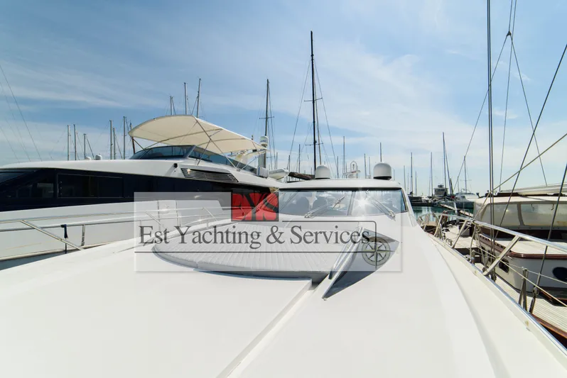  Yacht Photos Pics 2004 Sunseeker Predator 68 yacht docked at marina under clear blue sky.