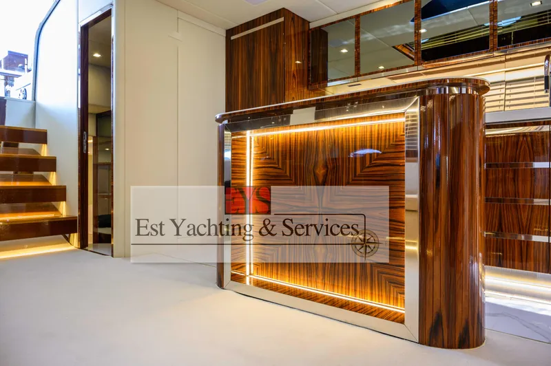  Yacht Photos Pics Luxurious interior of 2004 Sunseeker Predator 68 yacht with elegant wood finish and ambient lighting.