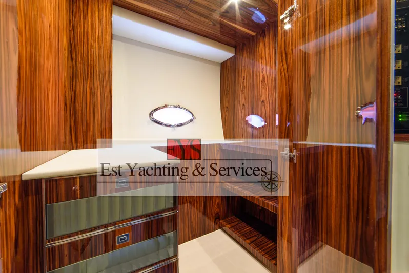  Yacht Photos Pics Luxurious interior of 2004 Sunseeker Predator 68 yacht with elegant wood finish.