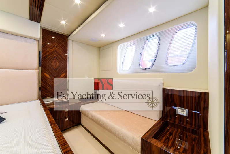  Yacht Photos Pics Luxurious interior of 2004 Sunseeker Predator 68 yacht with elegant wood finishes.