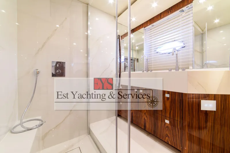  Yacht Photos Pics Luxurious bathroom interior of 2004 Sunseeker Predator 68 yacht with modern fixtures.