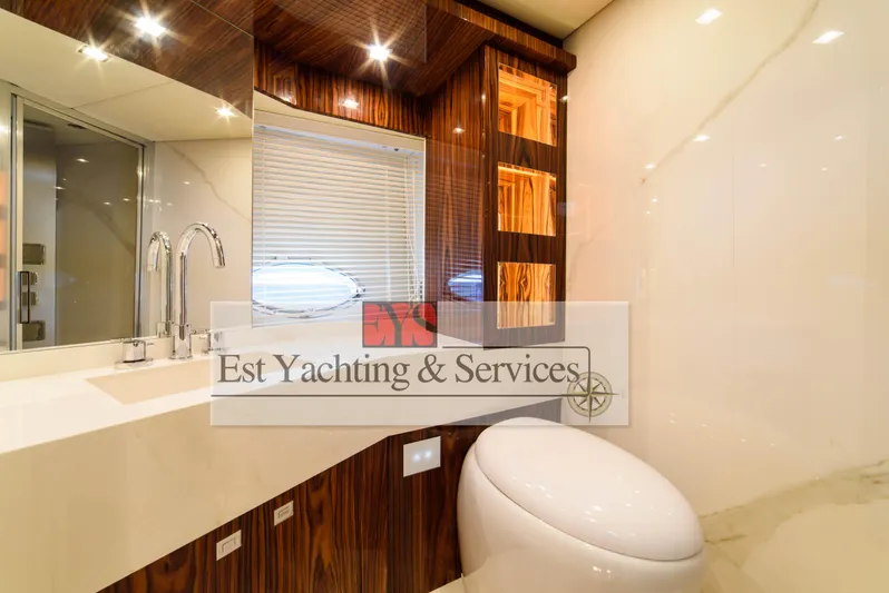  Yacht Photos Pics Luxurious bathroom interior of 2004 Sunseeker Predator 68 yacht with modern fixtures.