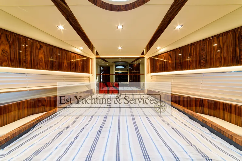  Yacht Photos Pics Luxurious interior of 2004 Sunseeker Predator 68 yacht with elegant wood paneling.