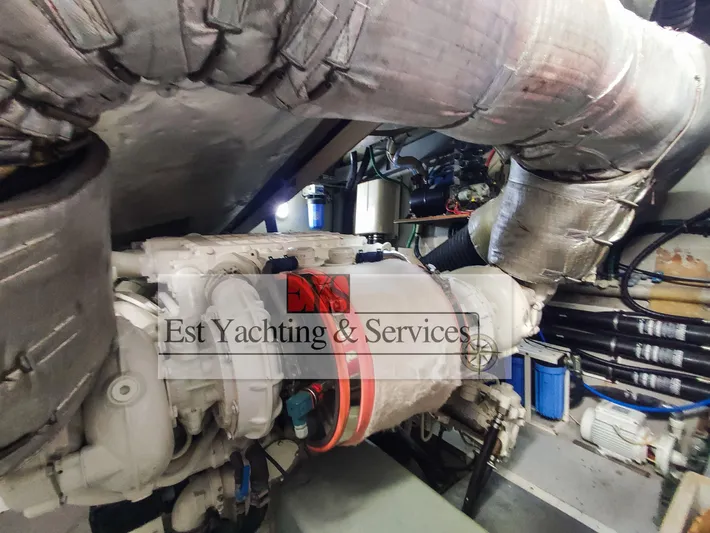  Yacht Photos Pics Engine room of 2004 Sunseeker Predator 68 yacht, featuring insulated pipes and mechanical components.