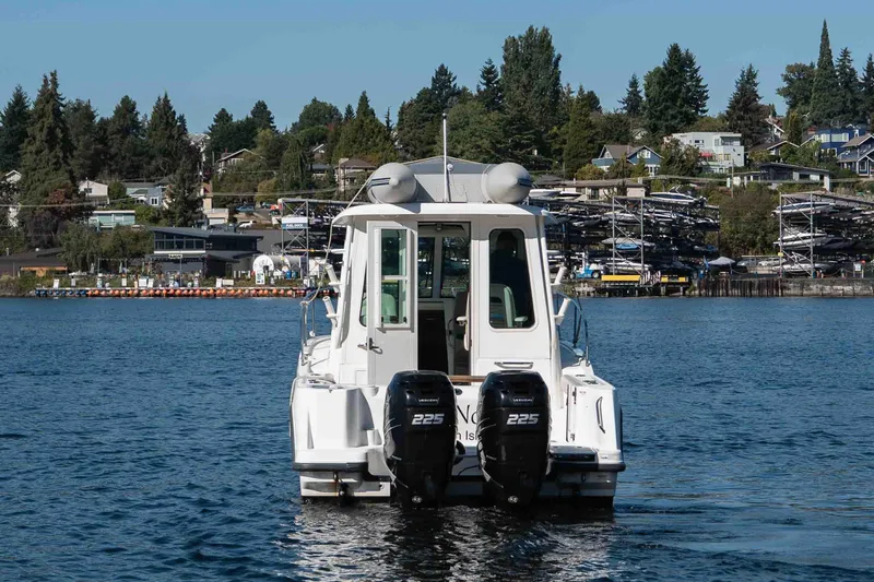  Yacht Photos Pics 2016 Boston Whaler 285 Conquest Pilothouse on water, with dual 225 engines.