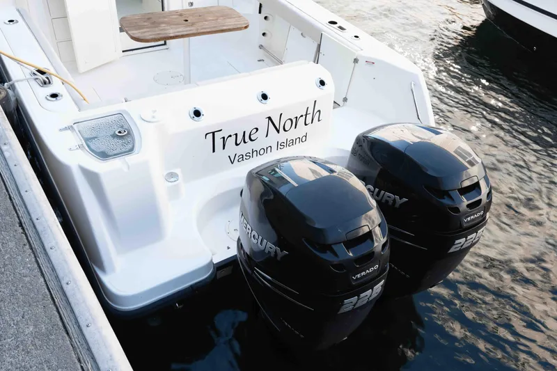  Yacht Photos Pics 2016 Boston Whaler 285 Conquest Pilothouse with twin Mercury Verado engines docked.