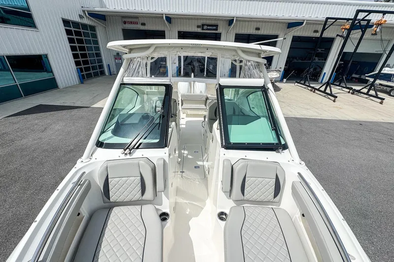  Yacht Photos Pics 2023 Pursuit DC 266 Dual Console boat with sleek design and comfortable seating.