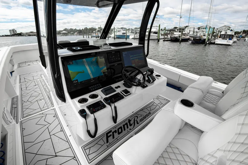  Yacht Photos Pics 2024 Front Runner 37 Catamaran cockpit with advanced navigation system and luxurious seating.