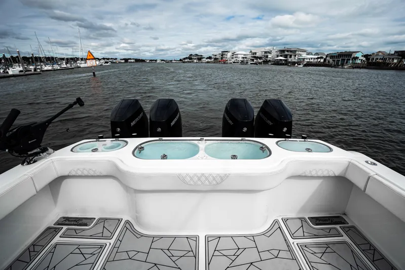  Yacht Photos Pics 2024 Front Runner 37 Catamaran with four Mercury engines on a calm waterway.