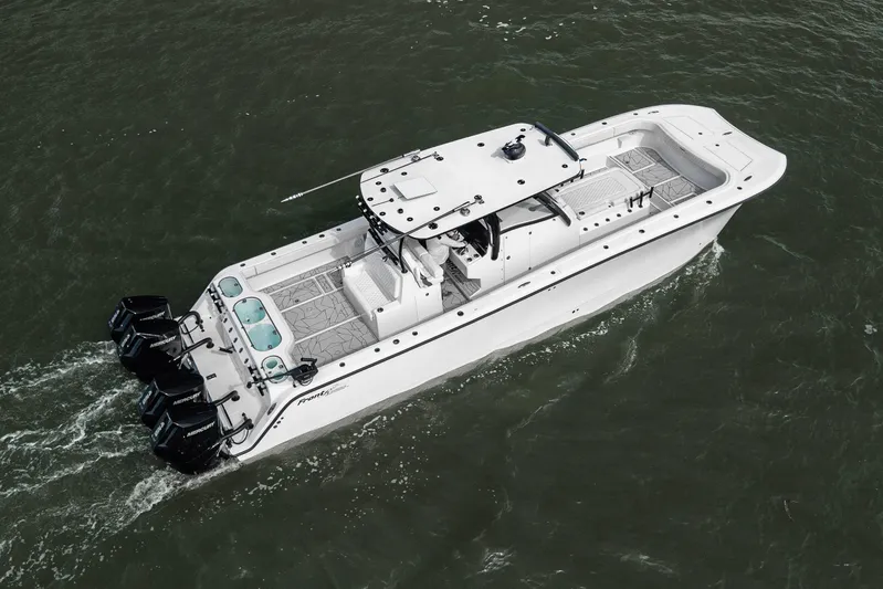  Yacht Photos Pics 2024 Front Runner 37 Catamaran cruising on water, featuring sleek design and powerful engines.