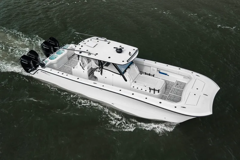  Yacht Photos Pics 2024 Front Runner 37 Catamaran cruising on water, showcasing sleek design and powerful engines.