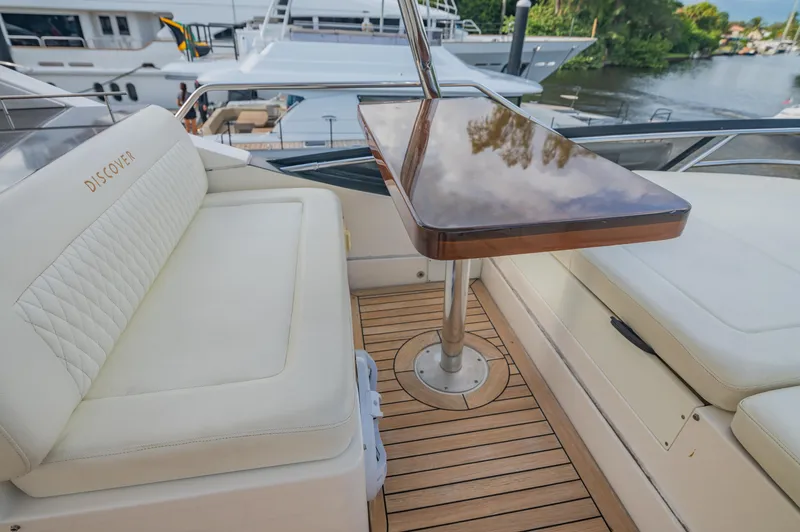 Discover Yacht Photos Pics Luxurious 2015 Sea Ray 510 Fly yacht deck with elegant seating and polished wood table.