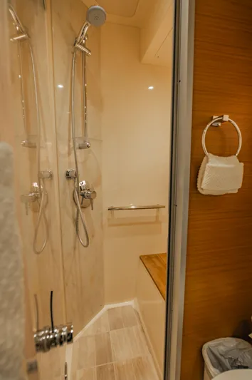 Discover Yacht Photos Pics Luxurious bathroom in 2015 Sea Ray 510 Fly yacht with modern shower fixtures.