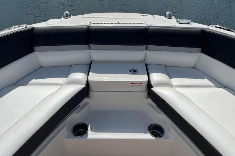  Yacht Photos Pics 2018 Sea Ray SLX 350 boat interior with white cushioned seating and cup holders.