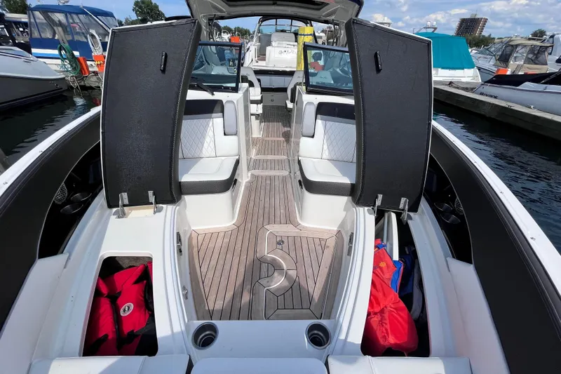  Yacht Photos Pics 2018 Sea Ray SLX 350 boat interior with open storage compartments and seating.