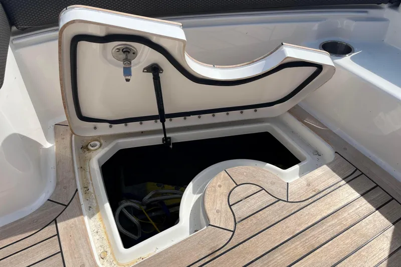  Yacht Photos Pics Open storage compartment on 2018 Sea Ray SLX 350 boat with wooden deck.