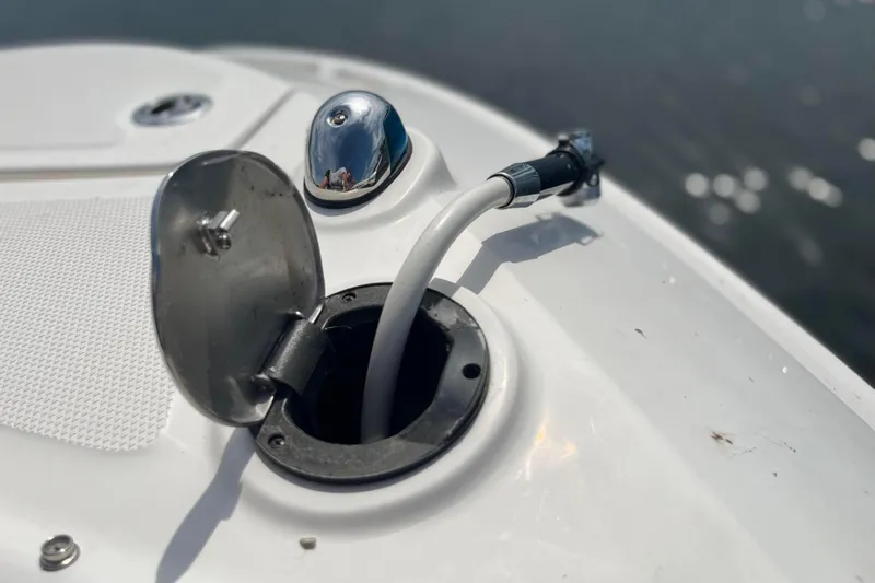  Yacht Photos Pics Fuel port on a 2018 Sea Ray SLX 350 boat, docked by water.