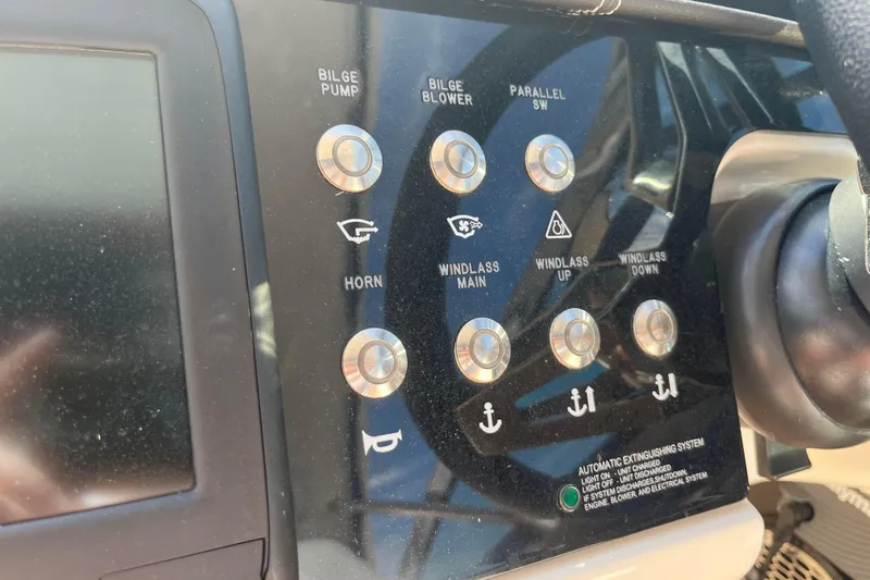  Yacht Photos Pics Control panel of a 2018 Sea Ray SLX 350 boat with various function buttons.
