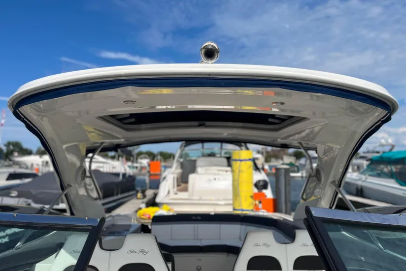  Yacht Photos Pics 2018 Sea Ray SLX 350 boat docked, showcasing sleek design and spacious seating.