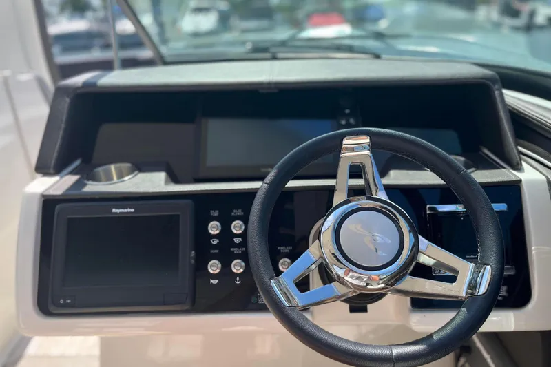  Yacht Photos Pics Steering wheel and dashboard of 2018 Sea Ray SLX 350 boat.