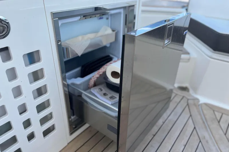  Yacht Photos Pics Open stainless steel drawer on 2018 Sea Ray SLX 350 boat, showing storage items.