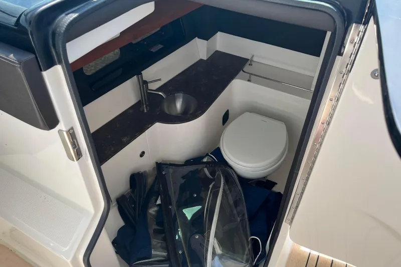  Yacht Photos Pics 2018 Sea Ray SLX 350 boat interior with compact bathroom and sink.