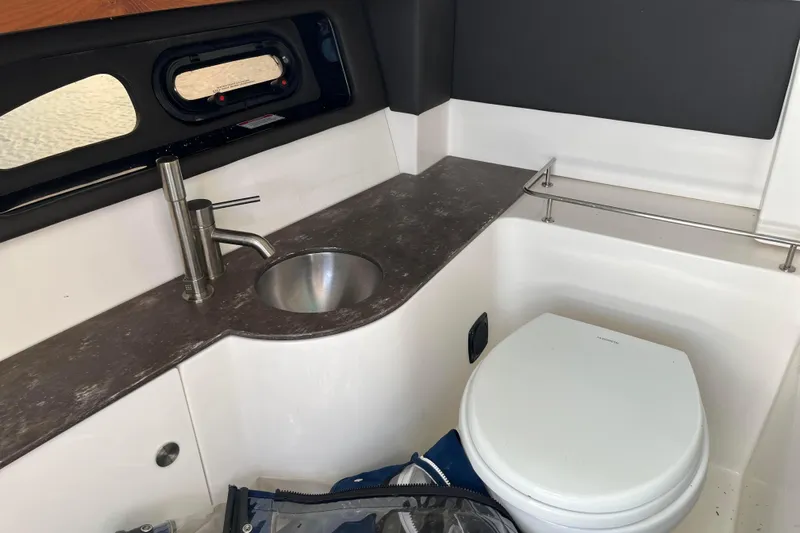  Yacht Photos Pics Interior of 2018 Sea Ray SLX 350 boat bathroom with sink and toilet.