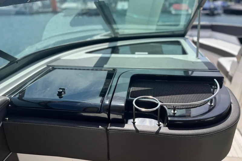  Yacht Photos Pics 2018 Sea Ray SLX 350 boat dashboard with cup holder and storage compartment.