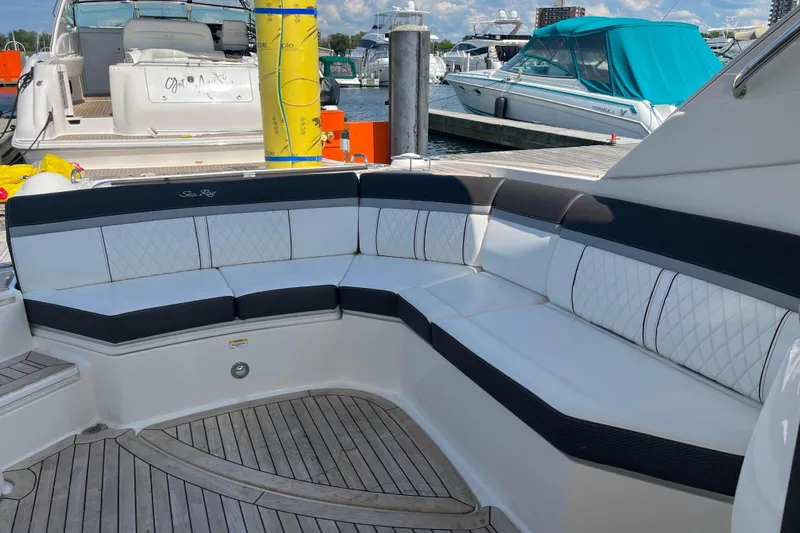  Yacht Photos Pics Luxury seating on a 2018 Sea Ray SLX 350 yacht at a marina.