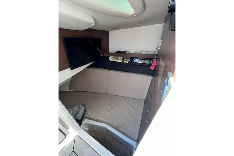  Yacht Photos Pics 2018 Sea Ray SLX 350 cabin interior with TV and seating area.