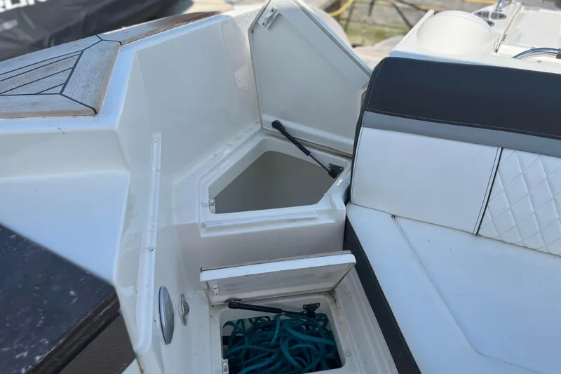  Yacht Photos Pics 2018 Sea Ray SLX 350 boat storage compartments with seating and rope.