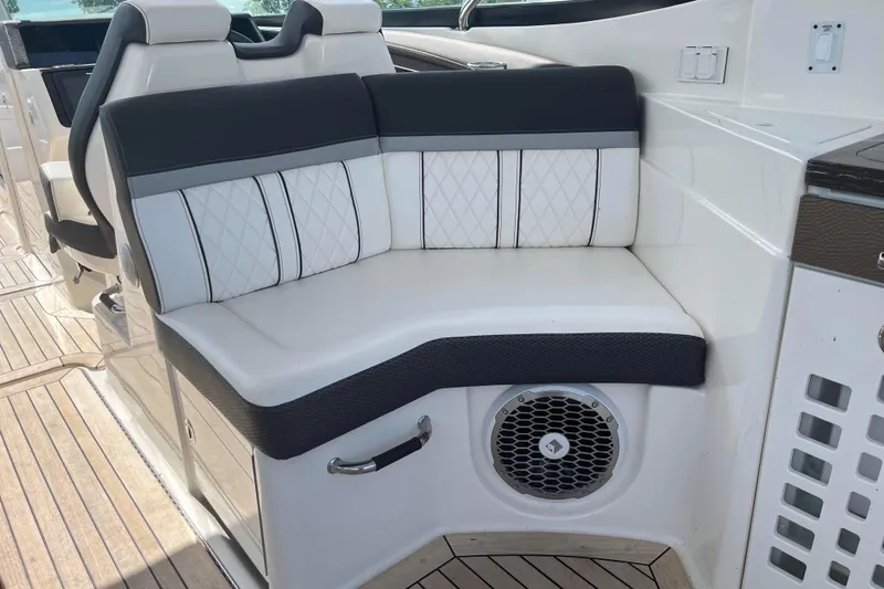  Yacht Photos Pics 2018 Sea Ray SLX 350 boat interior with cushioned seating and speaker.