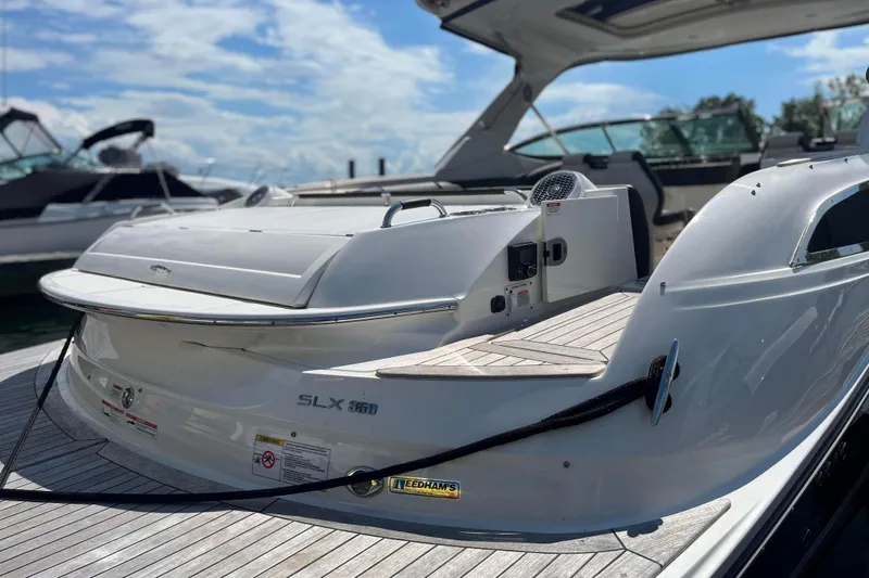  Yacht Photos Pics 2018 Sea Ray SLX 350 boat docked, showcasing sleek design and spacious deck.